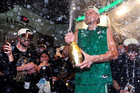Kristaps Porzingis sprays champagne